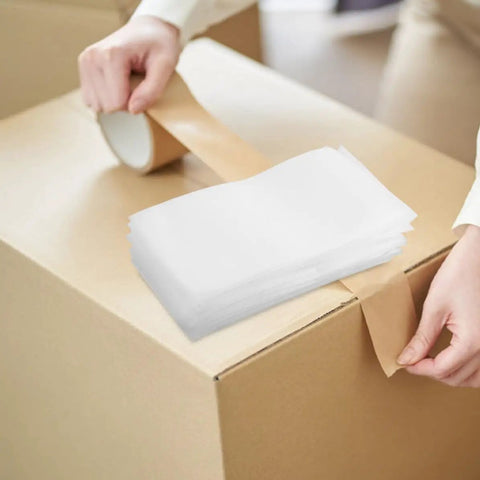White Epe Foam Wrap Pouches 200 Pack Heavy Duty Cushion Wrap for electronics, resting on a box being taped closed.
