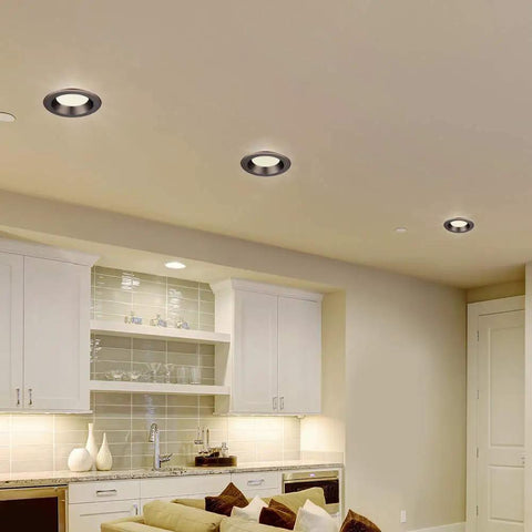 Installed Bronze Trim Integrated LED Recessed Ceiling Light Five To Six Inch Retrofit Kit in a modern kitchen setting