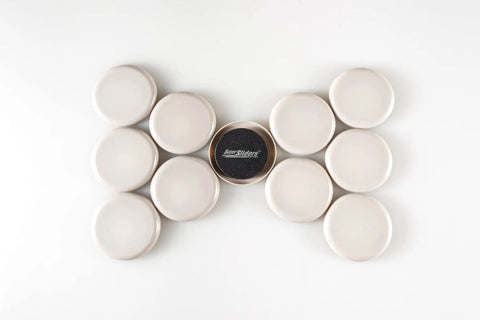Round Two And Half Inch Reusable Furniture Sliders For Carpet Eight Pack Beige arranged in a row on a white background