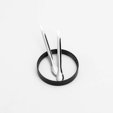 Two metal spoons and black scraper ring from 17 Piece Herb Grinder Cleaning Kit With Scrapers Spoons Long And Short Brushes And Storage Box.
