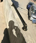 Heavy Duty Badass Wrought Iron Pipe Stair Handrail For Indoor Outdoor Use Rock Solid Wall Mount Banister For Decks Porches And Basements With Durable Bronze Finish mounted on concrete wall.