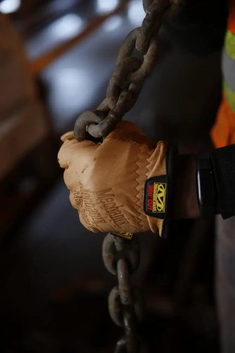 Flame And Arc Resistant Leather Driver Gloves With Durahide Leather, Water Repellent Finish, gripping a heavy chain, Size Large.