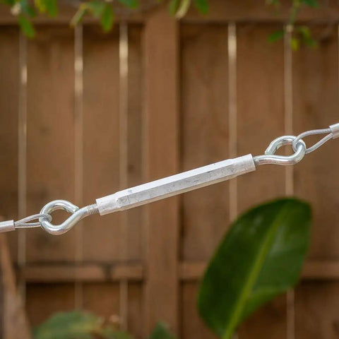 Close-up of High Grade Eye To Eye Turnbuckle Half By Seventeen Inch Aluminum Zinc Coated Hex Grip Cable Tensioner for rigging.