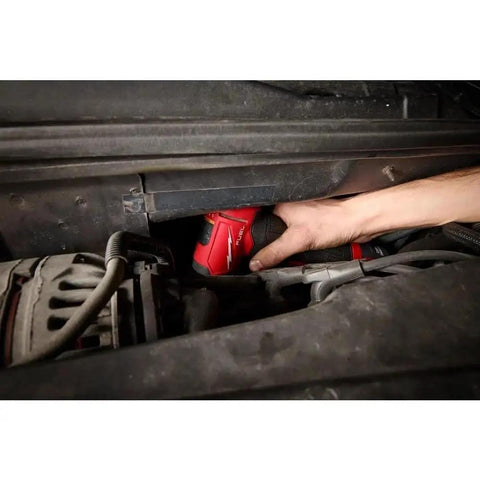 User operating the 3485-22 Brushless Right Angle Die Grinder Kit in a tight automotive space for detailed work.