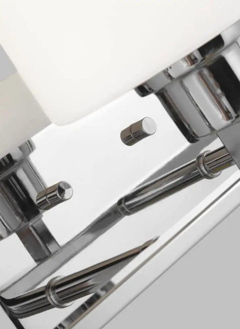 Close-up of Canfield Three Light Wall Bath Vanity Fixture in Brushed Nickel Finish with etched white glass shade detail