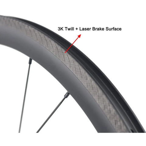 3K twill laser brake surface on 38mm aero rim of Dope 700C carbon clincher wheelset, highlighting material and design.