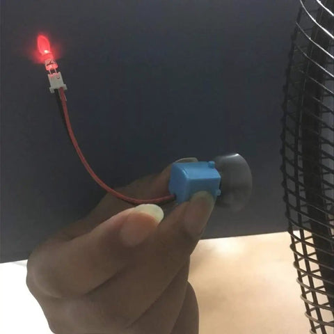 Hand holding a small Wind Hydroelectric Generator Model For STEM Classrooms, Hands On Renewable Energy Teaching Kit With Quick Assembly Parts