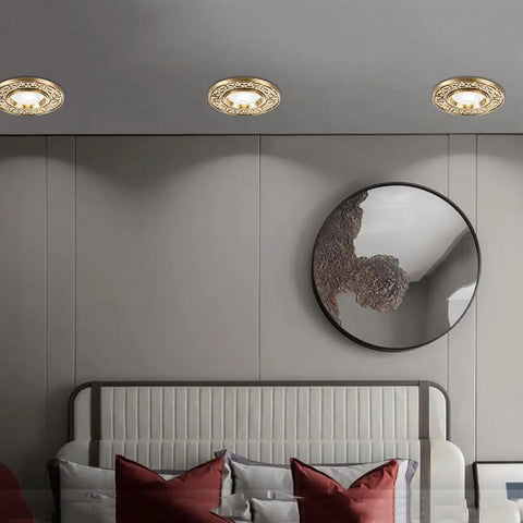 Rock Solid 9 Pack Recessed Lighting Trim Kits Premium Brass Finish Dimmable LED Ceiling Panels illuminating modern room decor.