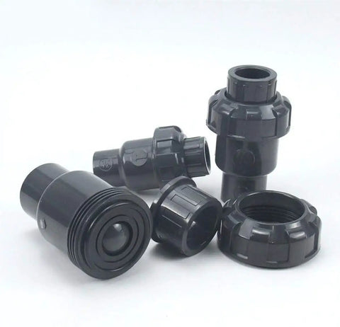 Heavy Duty Upvc Check Valve With Slick Spherical Seal And Knockout One Way Flow Control Ideal For Vertical Plumbing Installations That Crush Acid Exposure And Block Backflow Dead, black plastic body components.