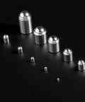 5x5mm Ball Plunger Set, 304 Stainless Steel Spring Loaded Ball Detent Plungers, arranged on a dark surface showcasing different sizes.