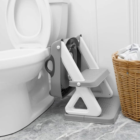 Super Secure Toddler Potty Ladder And Training Seat With Memory Foam Cushion Non Slip Base Fits All Standard Toilets next to toilet.