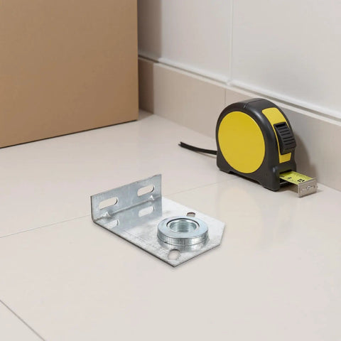 Heavy Duty Two Pack Garage Door Torsion Spring Center Bearing Bracket with one inch inner diameter on a floor beside a tape measure.