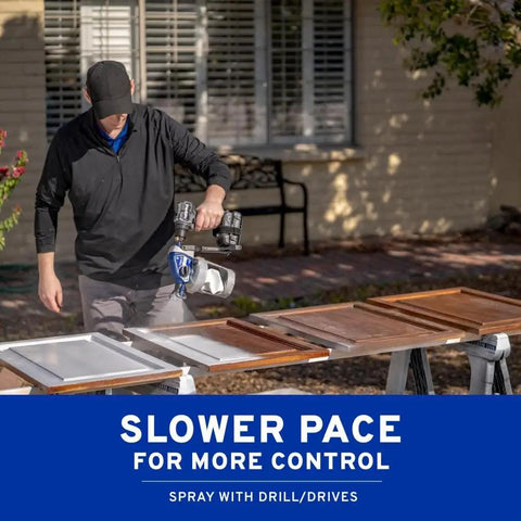 Professional Grade Drill Powered Paint Sprayer in use, painting doors with precision outdoors, fitting standard drills for DIY.