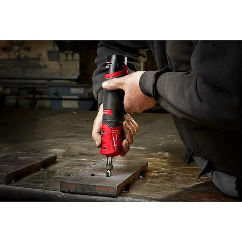 User operating the Kickass Cordless Die Grinder Kit With Dual 12V 2 Amp Batteries and Swift Charge Dock on metal surface.