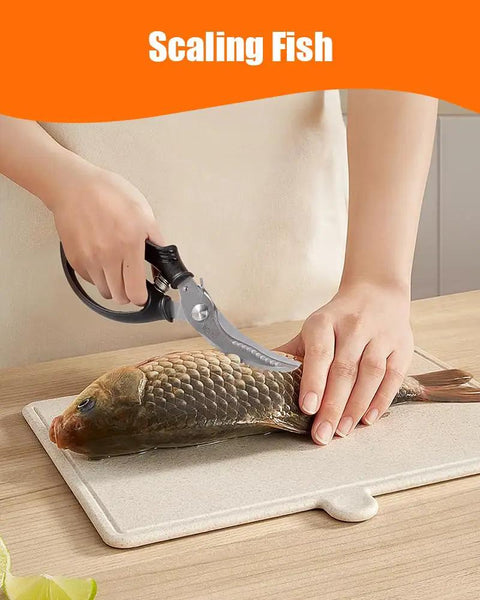 Super Tough Kitchen Shears That Make Light Work Of Cutting Whole Chickens Turkeys And Fish Bones Thanks To The Handy Spring Loaded Design Which Cuts Down Hand Fatigue Stainless Steel Scissors Built For Serious Kitchen Duty And Everyday Use scaling fish on a cutting board with stainless steel scissors.