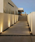 Outdoor path with 12 Pack 7W LED Landscape Well Lights, 720LM, 12-24V AC/DC Low Voltage, CRI90, IP67 Waterproof in black aluminum housing