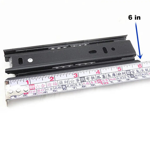 Six Inch Full Extension Drawer Slides with Telescoping Ball Bearing Rails and a measuring tape showing 6 inches in black metal.