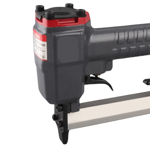 Lightweight 18 Gauge Pneumatic Brad Nailer Featuring A Durable Aluminum Frame And Reliable Trigger Action, side view with thumb trigger.