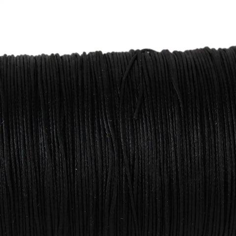 Rock Solid Waxed Thread For Leather Sewing And Bookbinding Hella Durable Half Millimeter Black Cord on spool, ideal for handcraft projects.