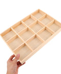 Knockout Solid Wood Jewelry Tray With 12 Grid Compartments, light wood organizer being held with smooth polished finish.