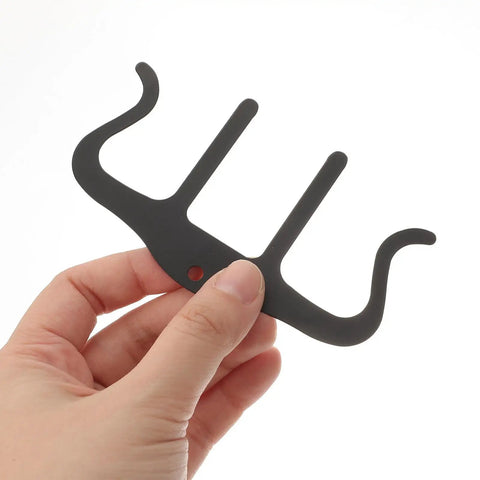 Three Piece M Shaped Metal Music Clips For Sheet Music And Notebooks Black Lightweight And Portable Piano Book Clips Perfect For Musicians On The Go Protect Pages And Fingers From Tears During Rehearsals, black metal clip held by hand