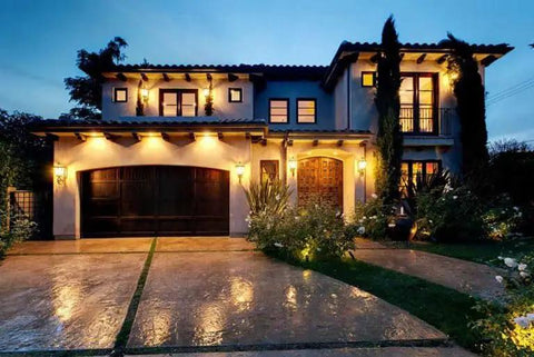 Top Shelf Pro Grade High Gloss Wet Look Concrete Sealer That Really Gonna Make Your Driveway Shine With Hard Hitting Protection And Deep Color Enhancement For A Solid Five Gallon Finish on a well-lit home exterior.