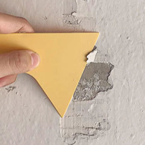 Quick Dry Wall Patch Kit for Holes and Cracks Easy Wall Filler Paste applied with scraper on damaged wall surface