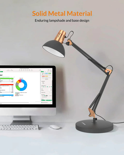 Rock Solid Metal Desk Lamp With Swing Arm And Clamp For Home Office Reading Light Built Tough Base Adjustable Task Lighting angled to show sturdy black metal design next to a computer.