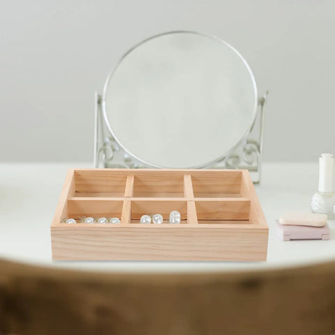 Six Compartment Pine Wood Jewelry Tray, Rustic Desktop Catch All For Rings And Necklaces on a vanity with pearls organized.