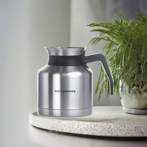 Thermal 1L Coffee Carafe With Brew Through Lid Keeps Coffee Hot While Brewing Stainless Steel Carafe on textured surface