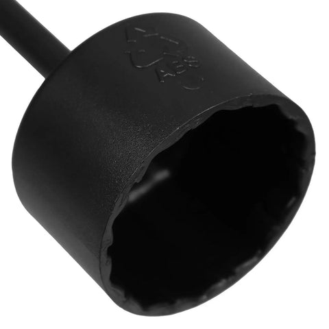 Close-up of a matte black plastic wrench from the Slick Eight Piece Light Socket Ring Remover Plastic Wrench Set G9 E14 E26 E27 Bulb Base Adapter.