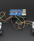 DC And Stepper Motor HAT For Raspberry Pi Mini Kit with two connected stepper motors, featuring TB6612 H-bridges and colorful wires