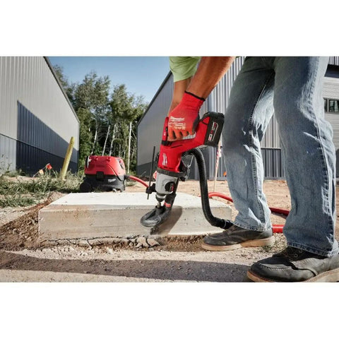 Top Shelf Brushless M18 Rotary Hammer With D Handle And Sds Plus Chuck in use drilling concrete on a construction site.