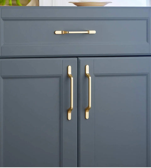 Top Shelf Heavy Gauge Zinc Alloy Cabinet Pulls Bow Handles Set Of Two Swanky Premium Electroplated Gold on gray kitchen cabinet.