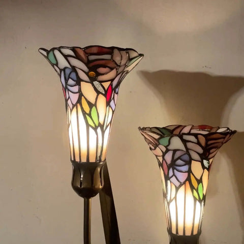 Close-up of Lily Flowers And Dragonfly Tiffany Style Stained Glass Table Lamp with warm multicolor glow, 19 inches tall