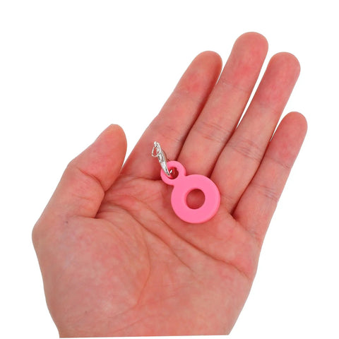 Pink silicone charm from Six Piece Set Straw Charms For Tumblers And Cups Cute Dangle Toppers That Are Easy To Attach Perfect Handle Decor For Parties And Family Events Colorful Water Cup Charms For Party Favors, displayed in hand.