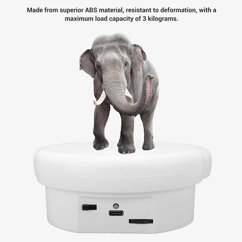 Premium Electric Rotary Turntable With 360 Smooth Spin For Jewelry And Watch Display Featuring Adjustable Speed USB Power And Strong Six Point Six Pound Load Bearing Capacity For Killer Photography Setup with an elephant on top.