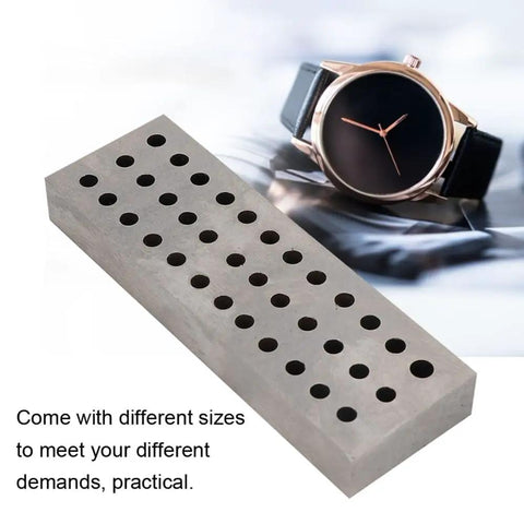 Heavy Duty Watch Staking Tool With Metal Plate 36 Holes Riveting Stake Set alongside a watch