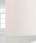 Easy Peasy Peel And Stick Beige Waterproof Wallpaper Roll on a smooth wall in a bright room, showcasing its simple application.