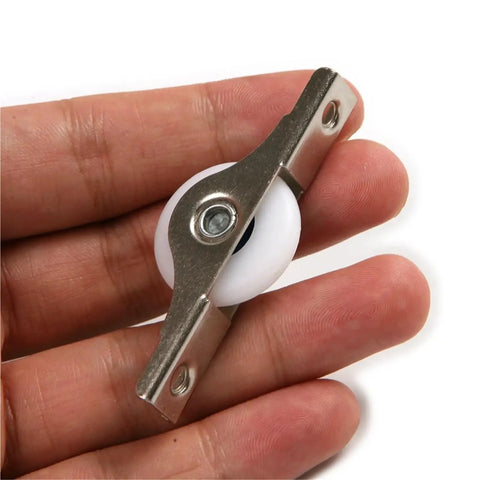 4 Pack 25Mm Sliding Door Rollers Nylon Caster Wheels Pulley Runners Silky Smooth Operation for cabinet hardware held in hand.