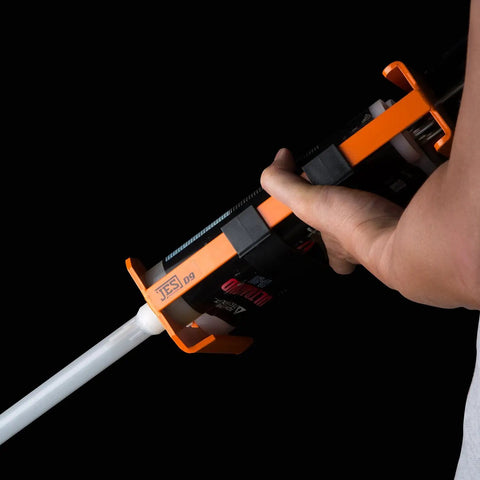 User holding Pro Grade 26 To 1 High Thrust Dual Component Cartridge Gun For 900 Ml Cartridges 2 To 1 against black background