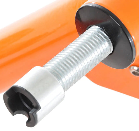 Close-up of the adjustment screw on the Orange Fluid Bike Trainer Pro Indoor Bicycle Training Stand For Serious Rides, Quiet Fluid Resistance.