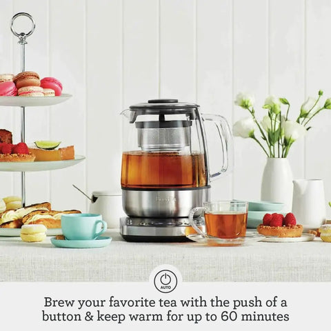 Tea Maker Infuser And Water Kettle 51 Oz Capacity With Programmable One Touch Controls And Auto Tea Basket Brushed Stainless Steel And Glass Kitchen Essential on table with tea and snacks