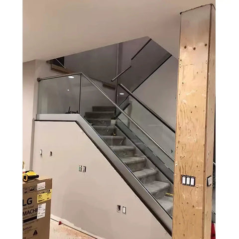 Premium Aluminum Base Rail Channel For Deck And Stairway Railing with clear glass on staircase, enhancing stability and design.