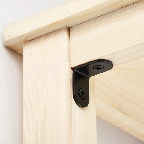 Black Stainless Steel Right Angle Corner Brackets Set With Screws installed on light wood, furniture fastener detail view.