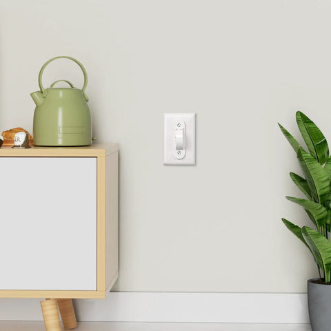 Wall Switch Guard 2 Pack Kid Proof Light Switch Cover With Toggle Style Protection on wall near cabinet and plant