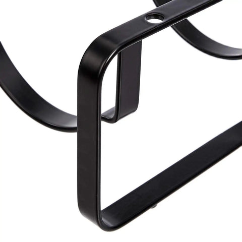 Close-up of Stackable Tabletop Wine Rack For Four Bottles Sleek Black Steel Holder with wave design and sturdy frame.