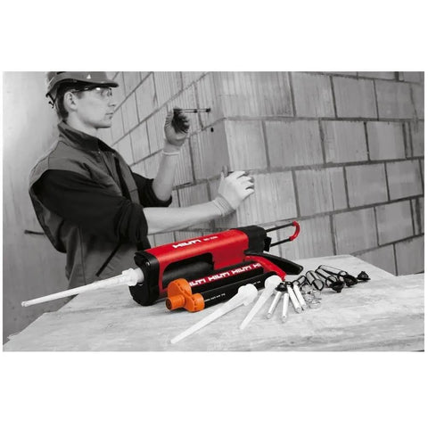 Black HIT-CB 500 Adhesive Anchor Cartridge Holder for concrete and masonry, shown on worksite with accessories and worker