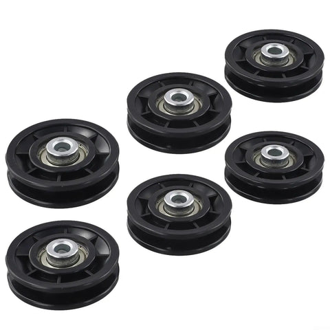 Six Piece Pulley Wheel Set For Home Gym And Cable Machines With Smooth Nylon Rollers And Steel Bearings In 70mm And 90mm Sizes, Quiet Durable Gear For Strength Training And Fitness Upgrades. Six black pulley wheels with steel bearings