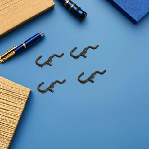 150 Pcs Plastic Pegboard Hooks For Tool Storage And Small Kitchen Supplies, Heavy Duty Repositionable Pegboard Hangers With Easy Assembly, Ideal For Retail Displays And Garage Organization, Studio Gear Black plastic pegboard hooks on blue surface